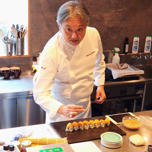 Chef Susumu Jimbo demonstrating sushi preparation